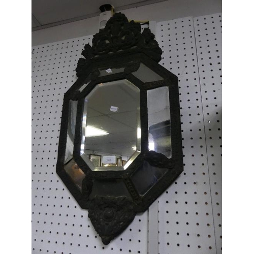 148 - A vintage Italianate embossed metal Wall Mirror, with scroll foliate crest, the central bevel-edged ... 