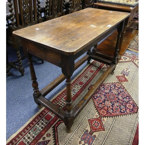 156 - A Georgian oak Side Table, the rounded rectangular top above frieze end-drawers, on turned and block... 