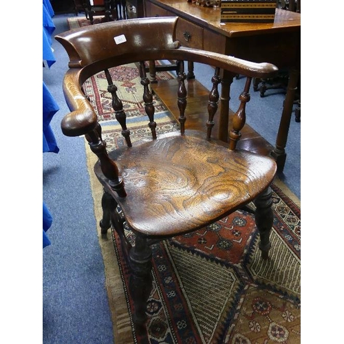 161 - A late Victorian ash and elm Smoker's Bow Armchair, the shaped seat with highly characterful grain.