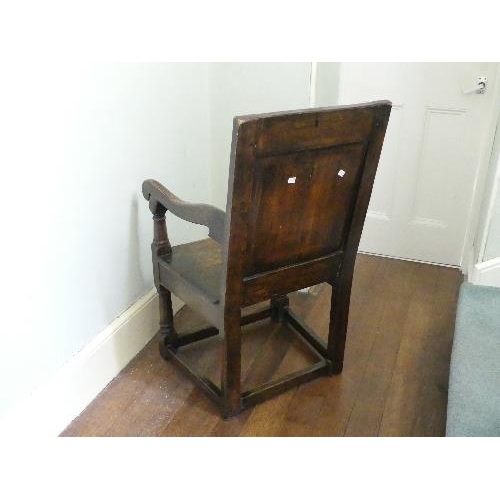 167 - An antique carved oak Wainscot Chair, the arched panelled back with floral marquetry decoration, scr... 