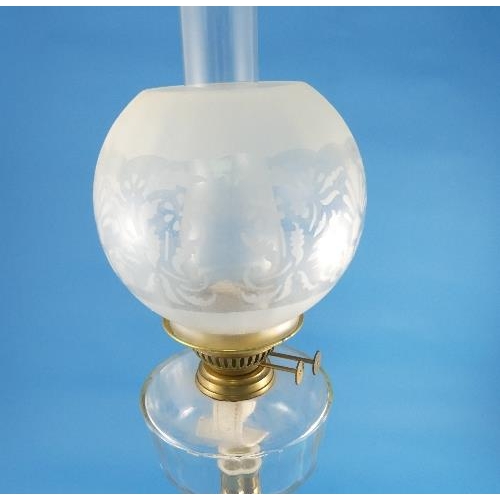 180 - A Victorian brass and glass Oil Lamp, with etched glass shade, 24½in (62cm) high.