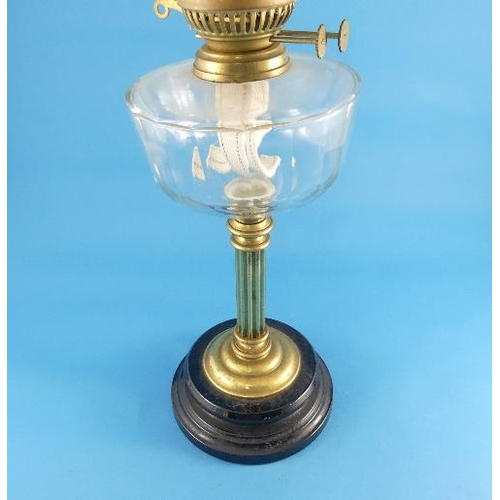 180 - A Victorian brass and glass Oil Lamp, with etched glass shade, 24½in (62cm) high.