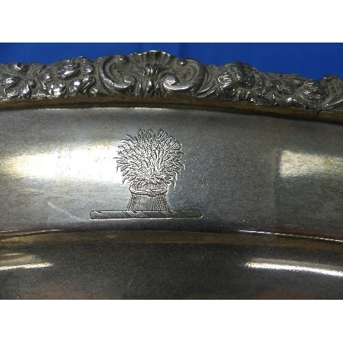 181 - A silver-plated oval Meat Warming Serving Platter, two-handled with foliate gadrooned edge on scroll... 