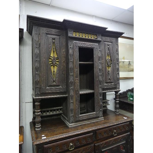 182 - A late Victorian carved oak Sideboard, with spindle and wheel panels, the break-front upper section ... 