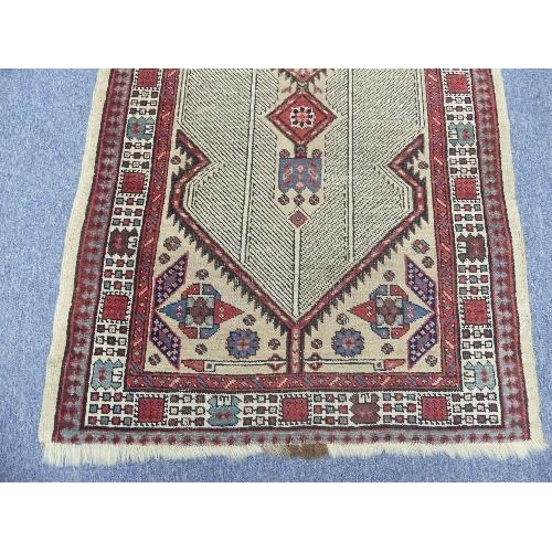 212 - Tribal Rugs; an antique Serab runner, the light beige ground woven with central diamond shaped medal... 