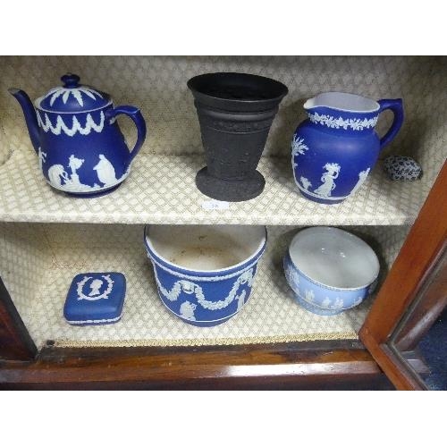 26 - A Wedgwood Black Basalt Vase, together with fourteen pieces of Wedgwood Blue Jasperware including va... 