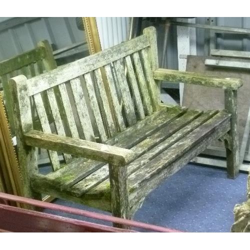 263 - A teak Garden Bench, labelled Woodfurn, Bristol, 49in (124.5cm) wide, together with another garden b... 