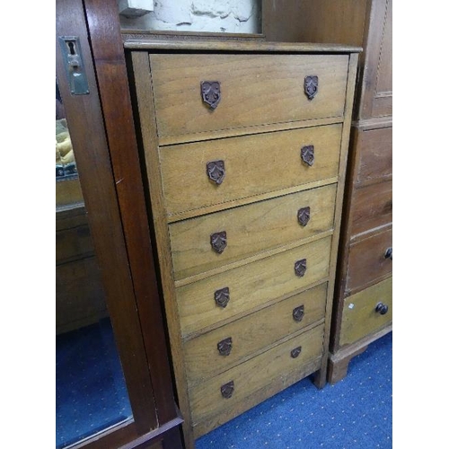 302 - A 1930's oak Bedroom Suite, comprising Triple and Double Wardrobes, Dressing Table, 4'6