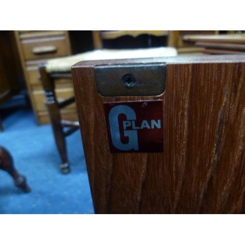 321 - A mid 20thC G-Plan teak 'Fresco' Sideboard, three drawers over four cupboards, G-Plan sticker inside... 