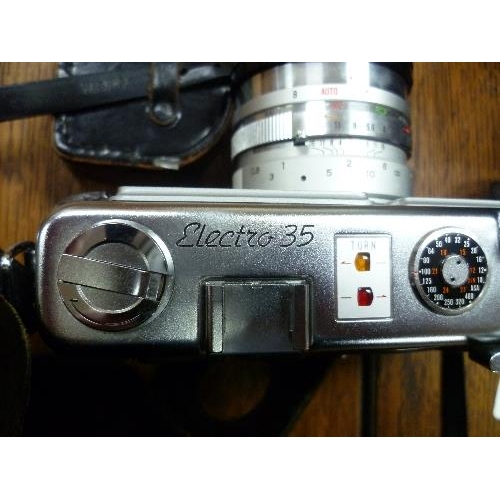 341 - A Yashika Electro 35 Camera, in fitted leather camera bag, with Zenith tripod, together with a retro... 