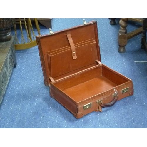 343 - A tan leather Brief Case.