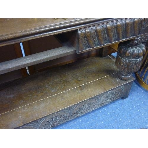 345 - An early 20th century oak Sideboard, the rectangular top above four frieze drawers on bulbous suppor... 