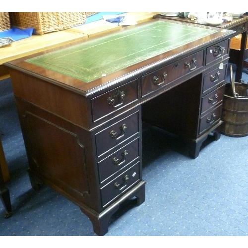 351 - A Georgian style pedestal Desk, the rectangular top with tooled green leather skiver, 48in (122cm) w... 