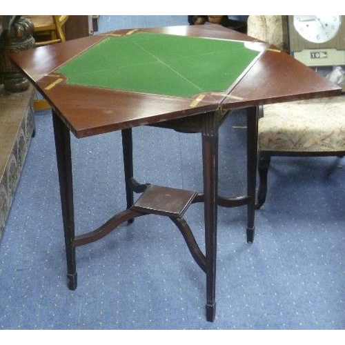 354 - An early 20thC envelope Card Table, with fold out circular card holders, together with a former comm... 