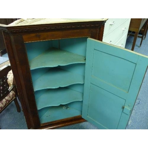 361 - A Georgian oak Corner Cupboard, with two panel door and dentil moulded pediment, 28in (71cm) wide.