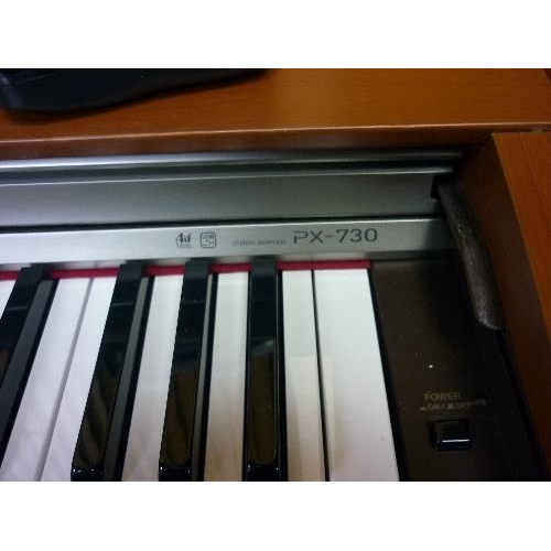 377 - A Casio Privia PX-730 electric Piano, with stool, 54in (137cm) long.