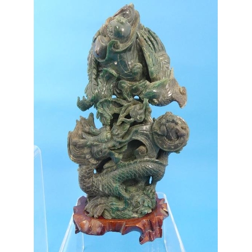 38 - A 20th century oriental jade Koro, with mask handles and pierced cover, on wood stand, 5¼in (13.5cm)... 