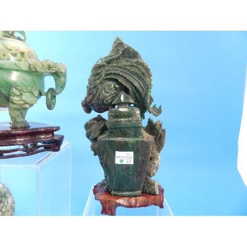 38 - A 20th century oriental jade Koro, with mask handles and pierced cover, on wood stand, 5¼in (13.5cm)... 