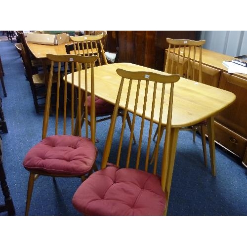 386 - An Ercol elm plank top Dining Table, of shaped rectangular form raised on four tapering legs, 48in (... 