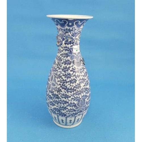 48 - A Chinese blue and white porcelain Vase, painted all over with foliage and flowerheads, the neck app... 