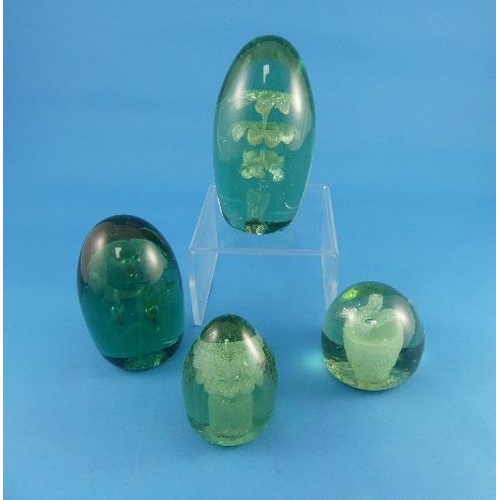 53 - Four Victorian green glass Dumps, with flower and vase decoration, largest 6in (15.25cm) high (4)