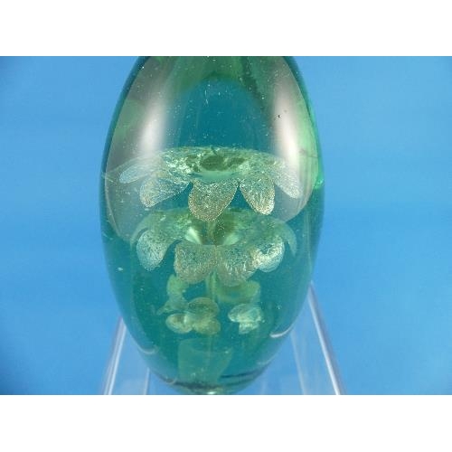 53 - Four Victorian green glass Dumps, with flower and vase decoration, largest 6in (15.25cm) high (4)