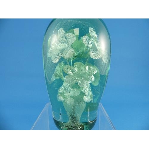 55 - Three Victorian green glass Dumps, with flower and vase decoration, largest 6in (15.25cm) high (3)