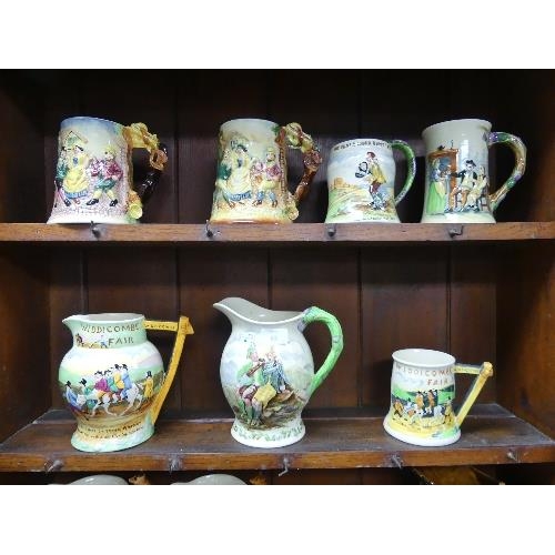 63 - A collection of fourteen Musical Jugs and Mugs, mainly Fieldings Crown Devon pottery, including John... 