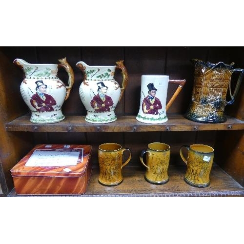 63 - A collection of fourteen Musical Jugs and Mugs, mainly Fieldings Crown Devon pottery, including John... 