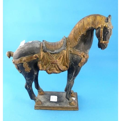 64B - A 20thC Tang Style earthenware Horse, decorated in black and gold.