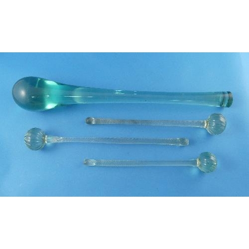 7 - Three Victorian green glass Friggers, of graduated size, each with a wrythen twist handle terminatin... 