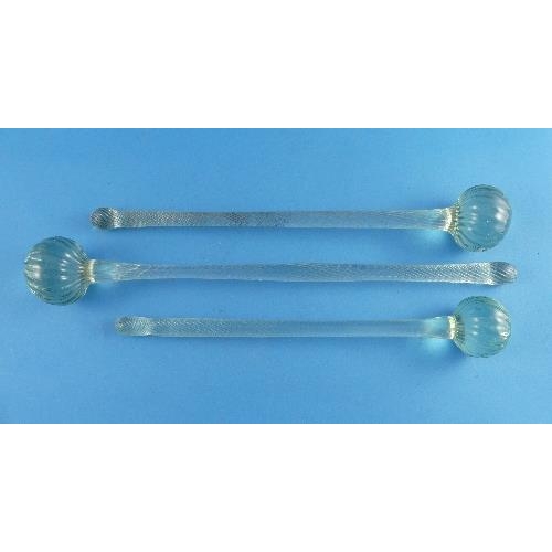 7 - Three Victorian green glass Friggers, of graduated size, each with a wrythen twist handle terminatin... 