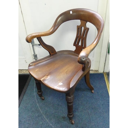 10 - An Edwardian walnut Captains/Desk Chair, with shaped back and seat, raised on turned front legs and ... 