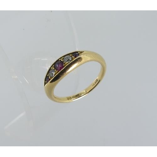 124 - A small 18ct yellow gold Ring, the flared front set with graduated rubies and diamonds, Size J.
