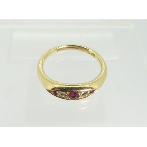 124 - A small 18ct yellow gold Ring, the flared front set with graduated rubies and diamonds, Size J.