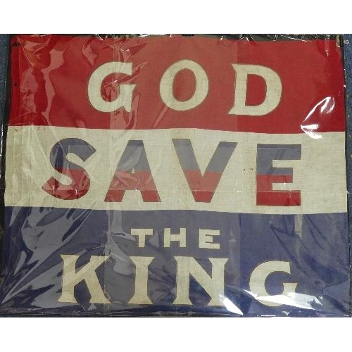 627 - An early 20thC 'God Save the King' cloth Flag, in red, white and blue, 35in (89cm) wide.