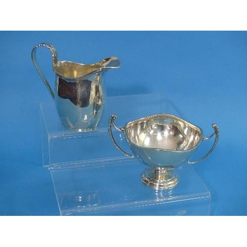 68 - A small George V silver Cream Jug, by S Blanckensee & Son Ltd. with leaf capped handle and beaded ri... 