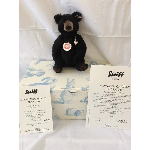 688 - Steiff; 'Winnipeg Grizzly Bear Cub', 036637, black, 23cm, limited edition no. 144 / 1500, together w... 