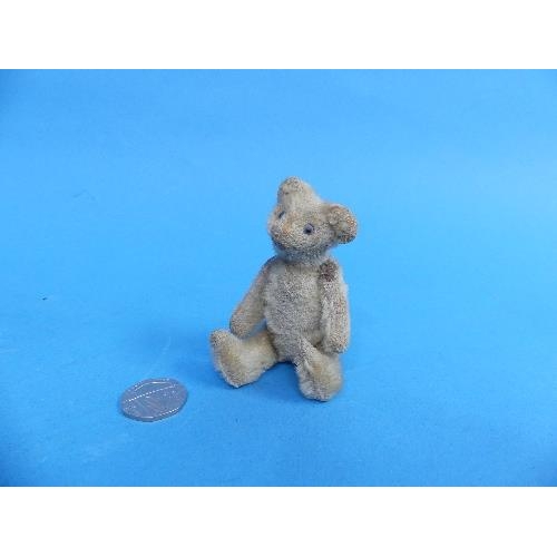 637 - A vintage miniature Teddy Bear, probably Schuco, 3½in (9cm) high.