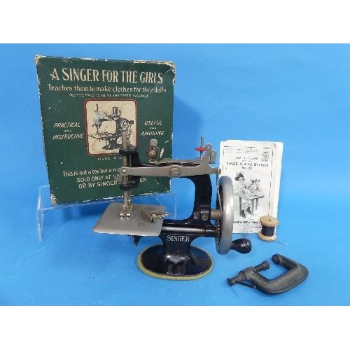 637A - An early 20thC 'Singer for the Girls' Miniature Sewing Machine, complete with clamp and instruction ... 