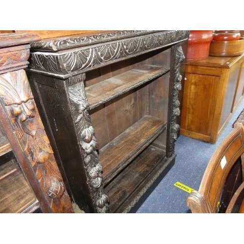 101 - A Victorian oak Open Bookcase, with carved decorations.