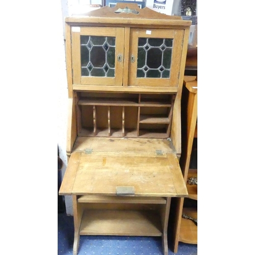 110 - An Arts and Crafts oak Upright Desk, with stained glass upon shelving and a drawer, width 28in x dep... 