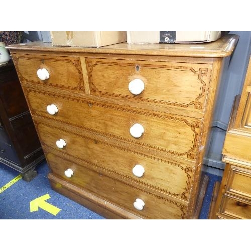 41 - A Victorian satinwood Chest of Drawers, two short over three long drawers, with white ceramic handle... 