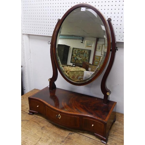 446 - A George III rosewood Toilet Mirror, a swinging oval plate upon a serpentine base with 3 fitted draw... 