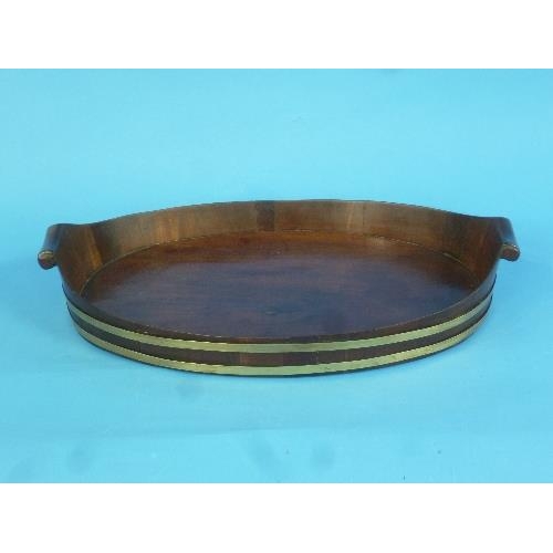 447 - A Georgian mahogany brass-bound oval Tray, with scroll handles, width 17½in x depth 11in (44cm x 27c... 