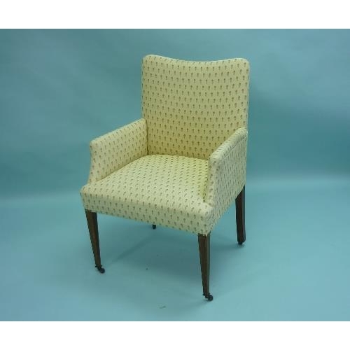 450 - An Edwardian upholstered Armchair, with inlaid mahogany tapered legs.