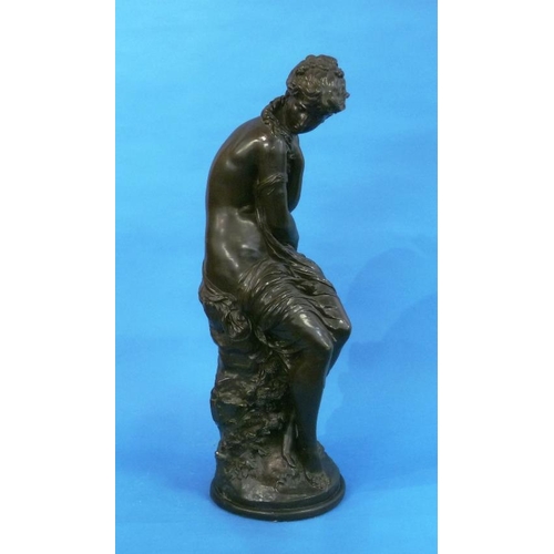 464 - After Mathurin Moreau, a cold-cast bronze female figure, partially clothed and seated on a rock, sig... 