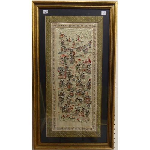 465 - An Oriental embroidered silk panel, depicting 