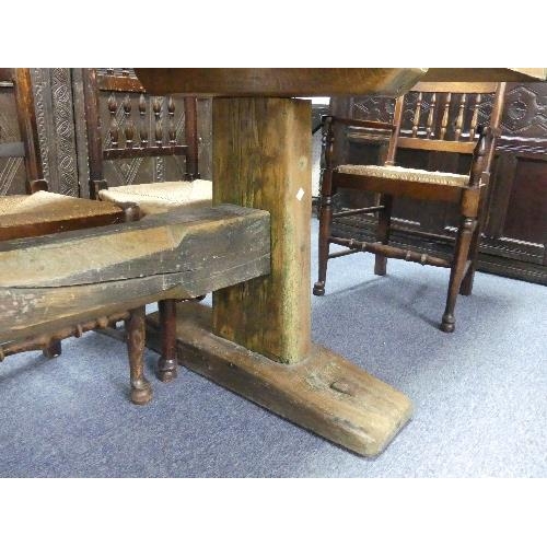 477 - A large Refectory Dining Table, the two-plank top with cleated ends, the base on supports and sledge... 