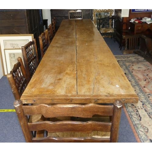 477 - A large Refectory Dining Table, the two-plank top with cleated ends, the base on supports and sledge... 